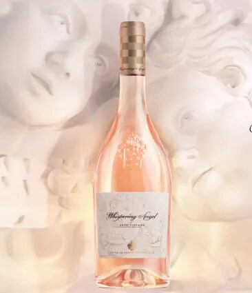 Whispering Angel rosé bottle with sculptural background in a soft artistic setting