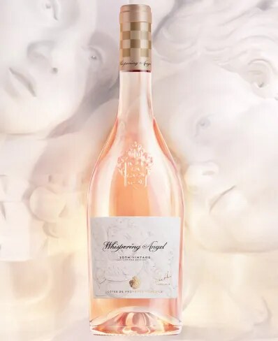 Whispering Angel rosé bottle with sculptural background in a soft artistic setting