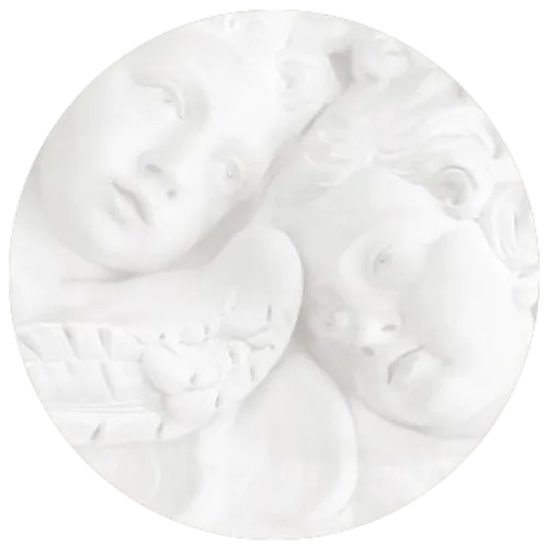 Carved marble cherub heads